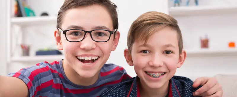 Two smiling boys at Petite Dental